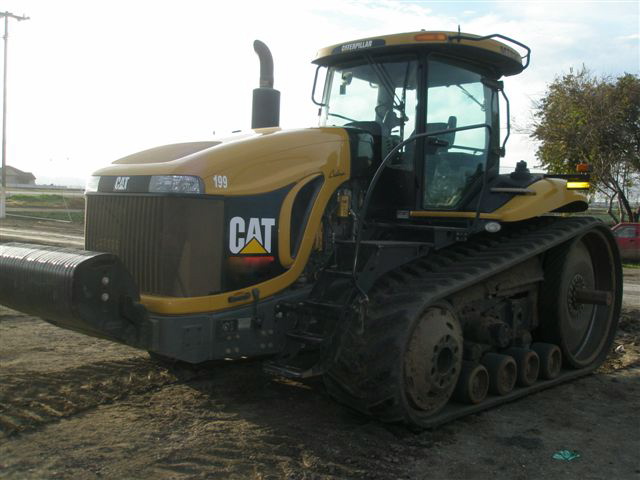 Used farm equipment on the Mid Iowa Equipment lot