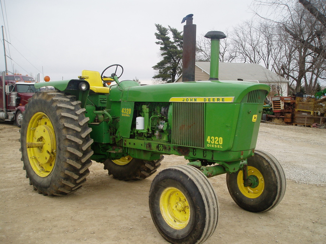 Used farm equipment on the Mid Iowa Equipment lot